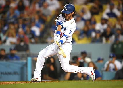 Aug 17, 2021; Los Angeles, California, USA;  Los Angeles Dodgers center fielder Cody Bellinger (35) hits a double in the third inning against the Pittsburgh Pirates at Dodger Stadium. Mandatory Credit: Jayne Kamin-Oncea-USA TODAY Sports