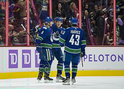 Nov 7, 2021; Vancouver, British Columbia, CAN; Vancouver Canucks forward J.T. Miller (9) and forward Bo Horvat (53) and defenseman Quinn Hughes (43) celebrate Miller   s goal against the Dallas Stars in the second period at Rogers Arena. Mandatory Credit: Bob Frid-USA TODAY Sports