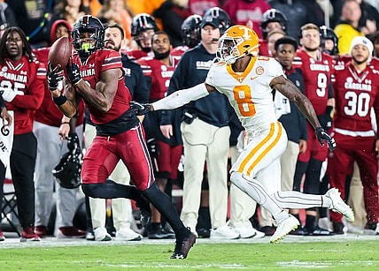 Nov 19, 2022; Columbia, South Carolina, USA; South Carolina Gamecocks tight end Jaheim Bell (0) drops a pass against Tennessee Volunteers defensive back Brandon Turnage (8) in the second quarter at Williams-Brice Stadium. Mandatory Credit: Jeff Blake-USA TODAY Sports