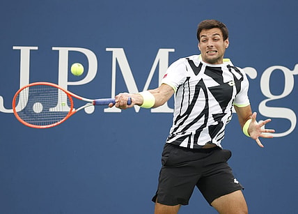 Sep 1, 2021; Flushing, NY, USA; Bernabe Zapata Miralles of Spain hits a shot against Felix Auger-Aliassime of Canada in a second round match on day three of the 2021 U.S. Open tennis tournament at USTA Billie Jean King National Tennis Center. Mandatory Credit: Jerry Lai-USA TODAY Sports
