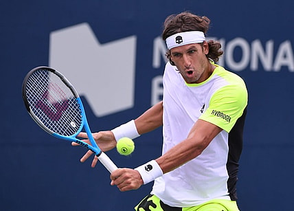 Aug 8, 2021; Toronto, Ontario, Canada;  Feliciano Lopez of Spain plays a shot against Yoshihito Nishioka of Japan during second round qualifying for the National Bank Open. Mandatory Credit: Dan Hamilton-USA TODAY Sports