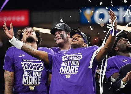 Washington Huskies quarterback Michael Penix Jr. (9), center, and his teammates watch as confetti begins to fall after winning the Sugar Bowl College Football Playoff semi-finals at the Ceasars Superdome in New Orleans, Louisiana, Jan. 1, 2024. The Huskies won the game over the Texas Longhorns 37-31.