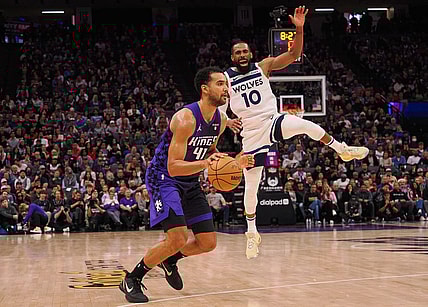 Dec 23, 2023; Sacramento, California, USA; Sacramento Kings forward Trey Lyles (41) controls the ball against Minnesota Timberwolves guard Mike Conley (10) during the fourth quarter at Golden 1 Center. Mandatory Credit: Kelley L Cox-USA TODAY Sports