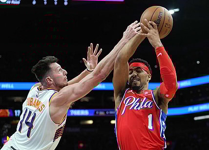Mar 20, 2024; Phoenix, Arizona, USA; Phoenix Suns forward Drew Eubanks (14) guards Philadelphia 76ers forward KJ Martin (1) during the first half at Footprint Center. Mandatory Credit: Joe Camporeale-USA TODAY Sports