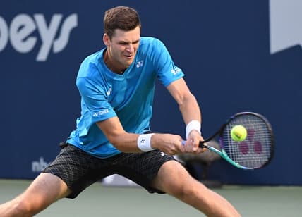 Aug 13, 2021; Toronto, Ontario, Canada; Hubert Hurkacz of Poland plays a shot against Daniil Medvedev of Russia during the quarter finals of the National Bank Open at Aviva Centre. Mandatory Credit: Dan Hamilton-USA TODAY Sports