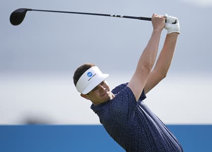 Feb 5, 2022; Pebble Beach, California, USA; Beau Hossler plays his shot on the 18th tee during the third round of the AT&T Pebble Beach Pro-Am golf tournament at Pebble Beach Golf Links. Mandatory Credit: Ray Acevedo-USA TODAY Sports