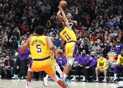 Feb 9, 2022; Portland, Oregon, USA;  Portland Trail Blazers guard Anfernee Simons (1) shoots over Los Angeles Lakers guard Malik Monk (11) in the second half at Moda Center. Mandatory Credit: Jaime Valdez-USA TODAY Sports