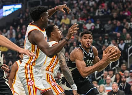 Oct 29, 2022; Milwaukee, Wisconsin, USA; Milwaukee Bucks forward Giannis Antetokounmpo (34) looks for a shot against Atlanta Hawks center Clint Capela (15) and  forward John Collins (20) in the first quarter at Fiserv Forum. Mandatory Credit: Benny Sieu-USA TODAY Sports