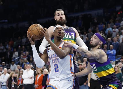 Feb 13, 2023; Oklahoma City, Oklahoma, USA; Oklahoma City Thunder guard Shai Gilgeous-Alexander (2) is defended by New Orleans Pelicans forward Herbert Jones (5) on a drive to the basket during the first quarter at Paycom Center. Mandatory Credit: Alonzo Adams-USA TODAY Sports