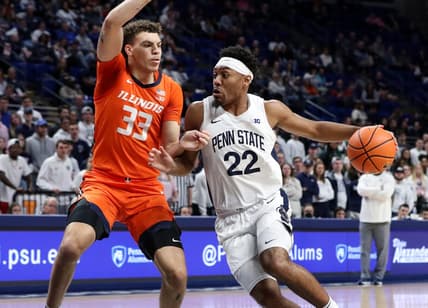 Feb 14, 2023; University Park, Pennsylvania, USA; Penn State Nittany Lions guard Jalen Pickett (22) dribbles the ball towards the basket as Illinois Fighting Illini forward Coleman Hawkins (33) defends during the first half at Bryce Jordan Center. Mandatory Credit: Matthew OHaren-USA TODAY Sports