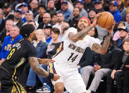 Mar 28, 2023; San Francisco, California, USA; New Orleans Pelicans small forward Brandon Ingram (14) looks to the basket against Golden State Warriors guard Gary Payton II (8) during the third quarter at Chase Center. Mandatory Credit: Kelley L Cox-USA TODAY Sports