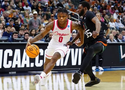 Mar 24, 2023; Kansas City, MO, USA; Houston Cougars guard Marcus Sasser (0) drives against Miami (Fl) Hurricanes guard Wooga Poplar (55) during the second half of an NCAA tournament Midwest Regional semifinal at T-Mobile Center. Mandatory Credit: Jay Biggerstaff-USA TODAY Sports