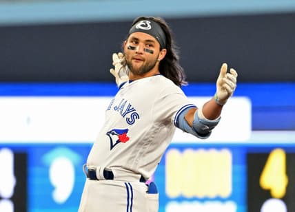 Apr 14, 2023; Toronto, Ontario, CAN;    Toronto Blue Jays shortstop Bo Bichette (11) reacts after hitting a double against the Tampa Bay Rays in the eighth inning at Rogers Centre. Mandatory Credit: Dan Hamilton-USA TODAY Sports