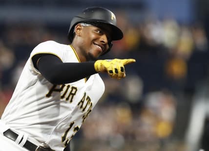 Sep 4, 2023; Pittsburgh, Pennsylvania, USA;  Pittsburgh Pirates third baseman Ke'Bryan Hayes (13) gestures to the dugout as he circles the bases on a solo home run against the Milwaukee Brewers during the fifth inning at PNC Park. Mandatory Credit: Charles LeClaire-USA TODAY Sports