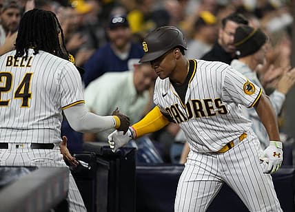 Aug 20, 2022; San Diego, California, USA;  San Diego Padres right fielder Juan Soto (22) greets designated hitter Josh Bell (left) after hitting a home run during the seventh inning against the Washington Nationals at Petco Park. Mandatory Credit: Ray Acevedo-USA TODAY Sports
