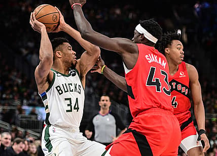 Mar 19, 2023; Milwaukee, Wisconsin, USA; Milwaukee Bucks forward Giannis Antetokounmpo (34) looks for a shot against Toronto Raptors forward Pascal Siakam (43) in the first quarter at Fiserv Forum. Mandatory Credit: Benny Sieu-USA TODAY Sports