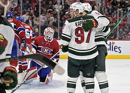 Oct 17, 2023; Montreal, Quebec, CAN; Minnesota Wild forward Joel Eriksson Ek (14) celebrates teammate forward Kirill Kaprizov (97) after scoring a goal against Montreal Canadiens goalie Sam Montembeault (35) during the third period at the Bell Centre. Mandatory Credit: Eric Bolte-USA TODAY Sports