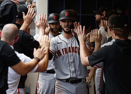 Aug 8, 2021; Milwaukee, Wisconsin, USA;  San Francisco Giants left fielder Kris Bryant (23) high fives teammates after scoring a run during the sixth inning against the Milwaukee Brewers at American Family Field. Mandatory Credit: Jeff Hanisch-USA TODAY Sports