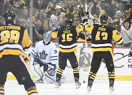 Oct 23, 2021; Pittsburgh, Pennsylvania, USA; Pittsburgh Penguins left wing Jason Zucker (16) and left wing Danton Heinen (43) celebrate after a second period goal against Toronto Maple Leafs goalie Jack Campbell (36) at PPG Paints Arena. Mandatory Credit: Philip G. Pavely-USA TODAY Sports