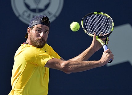 Aug 10, 2022; Montreal, QC, Canada; Maxime Cressy (USA) hits a backhand against Gael Monfils (FRA) (not pictured) in second round play at IGA Stadium. Mandatory Credit: Eric Bolte-USA TODAY Sports