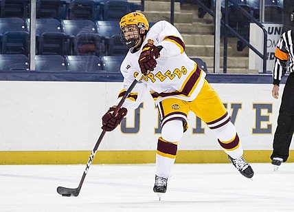 Mar 14, 2021; South Bend, Indiana, USA; Minnesota's Brock Faber (14) shoots against Michigan State at the Compton Family Ice Arena. Mandatory Credit: Michael Caterina/South Bend Tribune-USA TODAY NETWORK