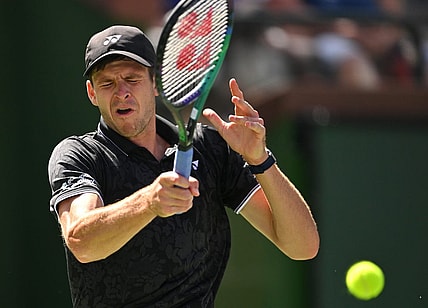 Mar 13, 2023; Indian Wells, CA, USA;  Hubert Hurkacz (POL) hits a shot in his fourth round match against Tommy Paul (USA) during the BNP Paribas Open at the Indian Wells Tennis Garden. Mandatory Credit: Jayne Kamin-Oncea-USA TODAY Sports