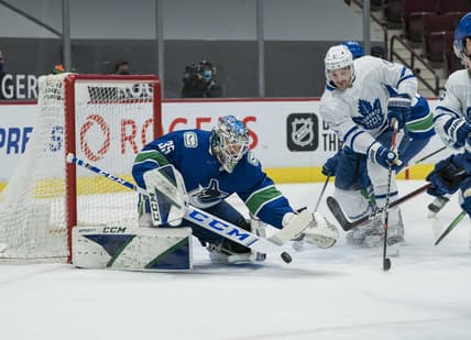 Mar 4, 2021; Vancouver, British Columbia, CAN; Vancouver Canucks goalie Thatcher Demko (35) makes a save on Toronto Maple Leafs forward  Zach Hyman (11) in the first period at Rogers Arena. Mandatory Credit: Bob Frid-USA TODAY Sports