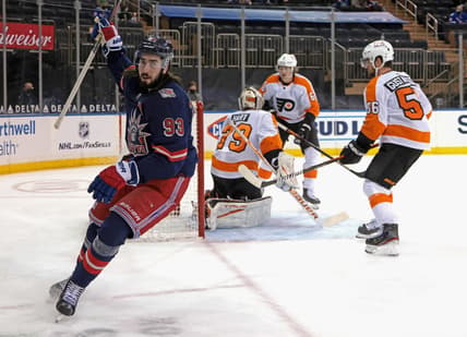 Mar 17, 2021; New York, New York, USA; New York Rangers center Mika Zibanejad (93) celebrates after scoring a power-play goal against Philadelphia Flyers goaltender Carter Hart (79) at 14:29 of the second period at Madison Square Garden. Mandatory Credit:  Bruce Bennett/POOL PHOTOS-USA TODAY Sports
