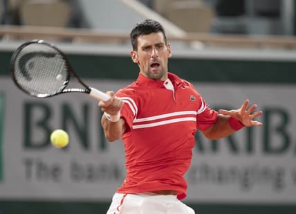 Jun 1, 2021; Paris, France; Novak Djokovic (SRB) in action during his match against Tennys Sandgren (USA) on day three of the French Open at Roland Garros Stadium. Mandatory Credit: Susan Mullane-USA TODAY Sports