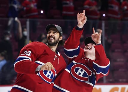 Jun 24, 2021; Montreal, Quebec, CAN; Montreal Canadiens players celebrate after winning game six of the 2021 Stanley Cup Semifinals against the Vegas Golden Knights at the Bell Centre. Mandatory Credit: Eric Bolte-USA TODAY Sports