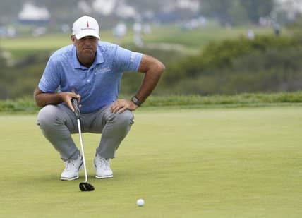 Jun 18, 2021; San Diego, California, USA; Stewart Cink lines up a putt on the 13th green during the second round of the U.S. Open golf tournament at Torrey Pines Golf Course. Mandatory Credit: Michael Madrid-USA TODAY Sports