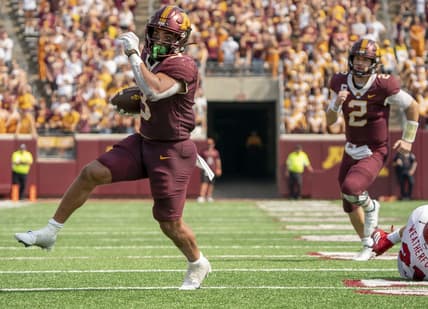 Sep 11, 2021; Minneapolis, Minnesota, USA; Minnesota Golden Gophers running back Treyson Potts (3) scores in the fourth quarter after evading Miami (OH) Redhawks defensive back Sterling Weatherford (21), Minnesota Golden Gophers quarterback Tanner Morgan (2) follows at Huntington Bank Stadium. Mandatory Credit: Matt Blewett-USA TODAY Sports