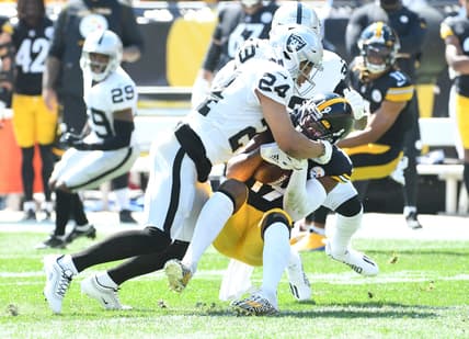 Sep 19, 2021; Pittsburgh, Pennsylvania, USA; Las Vegas Raiders safety Jonathan Abram tackles Pittsburgh Steelers wide receiver JuJu Smith-Schuster after a five yard gain in the first qwuarter at Heinz Field. Mandatory Credit: Philip G. Pavely-USA TODAY Sports