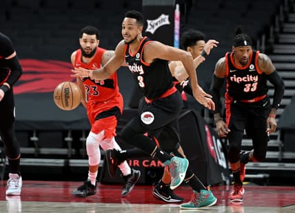 Jan 23, 2022; Toronto, Ontario, CAN;  Portland Trail Blazers gard CJ McCollum (3) dribbles the ball away from Toronto Raptors guard Fred VanVleet (23) in the first half at Scotiabank Arena. Mandatory Credit: Dan Hamilton-USA TODAY Sports