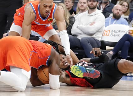 Jan 31, 2022; Oklahoma City, Oklahoma, USA; Portland Trail Blazers guard Ben McLemore (23) and Oklahoma City Thunder forward Luguentz Dort (5) fight for a loose ball during the second half at Paycom Center. Mandatory Credit: Alonzo Adams-USA TODAY Sports