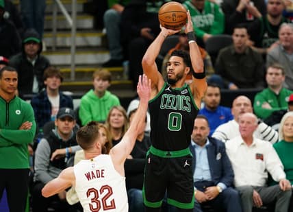 Oct 28, 2022; Boston, Massachusetts, USA; Boston Celtics forward Jayson Tatum (0) shoots for three points against Cleveland Cavaliers forward Dean Wade (32) in the first quarter at TD Garden. Mandatory Credit: David Butler II-USA TODAY Sports