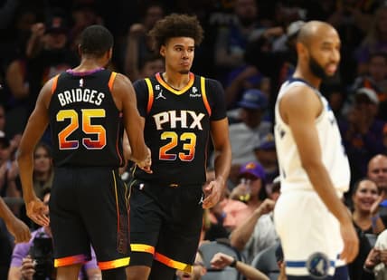 Nov 1, 2022; Phoenix, Arizona, USA; Phoenix Suns forward Cameron Johnson (23) celebrates a play with Mikal Bridges (25) against the Minnesota Timberwolves in the first half at Footprint Center. Mandatory Credit: Mark J. Rebilas-USA TODAY Sports