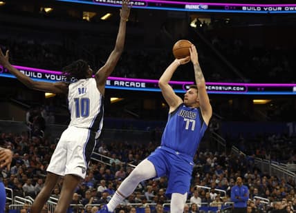 Nov 9, 2022; Orlando, Florida, USA; Dallas Mavericks guard Luka Doncic (77) shoots over Orlando Magic center Bol Bol (10) during the first quarter at Amway Center. Mandatory Credit: Kim Klement-USA TODAY Sports