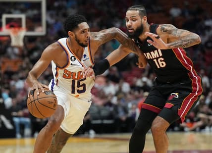 Nov 14, 2022; Miami, Florida, USA;Phoenix Suns guard Cameron Payne (15) drives past Miami Heat forward Caleb Martin (16) in the first half at FTX Arena. Mandatory Credit: Jim Rassol-USA TODAY Sports
