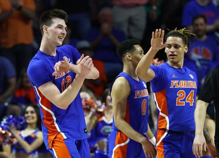 Feb 1, 2023; Gainesville, Florida, USA; Florida Gators forward Colin Castleton (12) celebrates after making a basket against the Tennessee Volunteers during the second half at Exactech Arena at the Stephen C. O'Connell Center. Mandatory Credit: Kim Klement-USA TODAY Sports