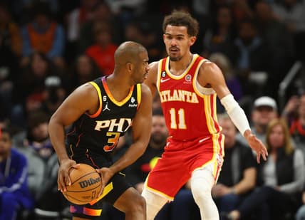 Feb 1, 2023; Phoenix, Arizona, USA; Phoenix Suns guard Chris Paul (3) controls the ball against Atlanta Hawks guard Trae Young (11) in the second half at Footprint Center. Mandatory Credit: Mark J. Rebilas-USA TODAY Sports