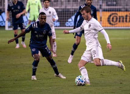 Oct 24, 2020; Kansas City, Kansas, USA; Colorado Rapids defender Jeremy Kelly (18) moves the ball as Sporting Kansas City midfielder Gadi Kinda (17) defends during the match at Children's Mercy Park. Mandatory Credit: Denny Medley-USA TODAY Sports