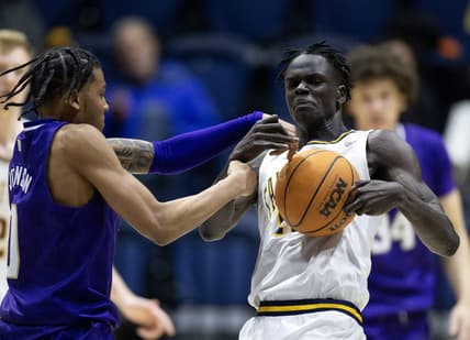 Feb 23, 2023; Berkeley, California, USA; Washington Huskies guard Koren Johnson (0) and California Golden Bears forward Kuany Kuany (13) wrestle for control of a loose ball during the second half at Haas Pavilion. Both players were assessed technical fouls on the play. Mandatory Credit: D. Ross Cameron-USA TODAY Sports