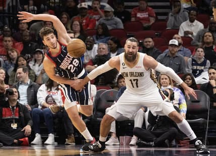 Mar 17, 2023; Houston, Texas, USA; Houston Rockets center Alperen Sengun (28) knocks the ball from New Orleans Pelicans center Jonas Valanciunas (17) in the fourth quarter at Toyota Center. Mandatory Credit: Thomas Shea-USA TODAY Sports