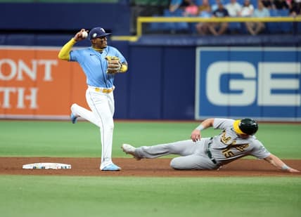 Apr 8, 2023; St. Petersburg, Florida, USA; Tampa Bay Rays shortstop Wander Franco (5) forces out Oakland Athletics left fielder Seth Brown (15) during the fifth inning at Tropicana Field. Mandatory Credit: Kim Klement-USA TODAY Sports