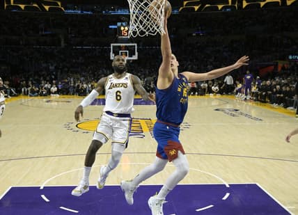 May 20, 2023; Los Angeles, California, USA; Denver Nuggets center Nikola Jokic (15) shoots against Los Angeles Lakers forward LeBron James (6) in the first half during game three of the Western Conference Finals for the 2023 NBA playoffs at Crypto.com Arena. Mandatory Credit: Jayne Kamin-Oncea-USA TODAY Sports