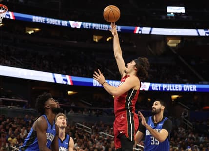 Dec 20, 2023; Orlando, Florida, USA; Miami Heat guard Jaime Jaquez Jr. (11) shoots a layup against the Orlando Magic during the first quarter at KIA Center. Mandatory Credit: Kim Klement Neitzel-USA TODAY Sports