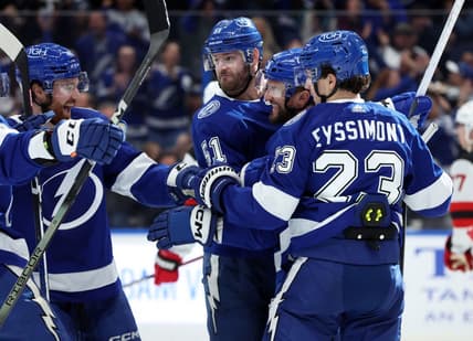 Jan 11, 2024; Tampa, Florida, USA; Tampa Bay Lightning center Luke Glendening (11) is congratulated after he scored a goal against the New Jersey Devils during the first period at Amalie Arena. Mandatory Credit: Kim Klement Neitzel-USA TODAY Sports