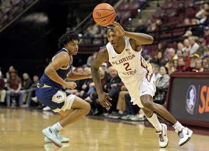 Jan 3, 2024; Tallahassee, Florida, USA; Florida State Seminoles forward Jamir Watkins (2) dribbles towards the net during the first half against the Georgia Tech Yellow Jackets at Donald L. Tucker Center. Mandatory Credit: Melina Myers-USA TODAY Sports