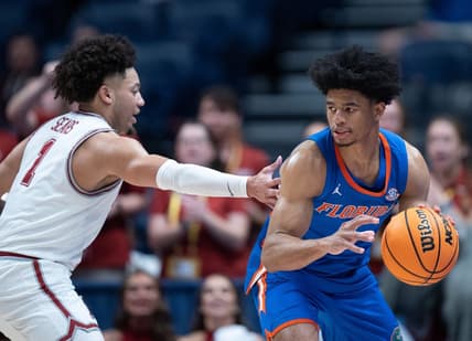 Alabama Crimson Tide guard Mark Sears (1) guards Florida Gators guard Zyon Pullin (0) during their SEC Men's Basketball Tournament quarterfinal game at Bridgestone Arena in Nashville, Tenn., Friday, March 15, 2024.at Bridgestone Arena in Nashville, Tenn., Friday, March 15, 2024.